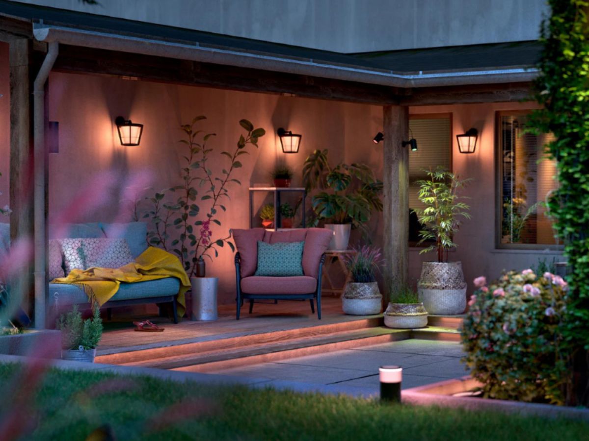 Smart backyard outdoor lights illuminating a modern home garden